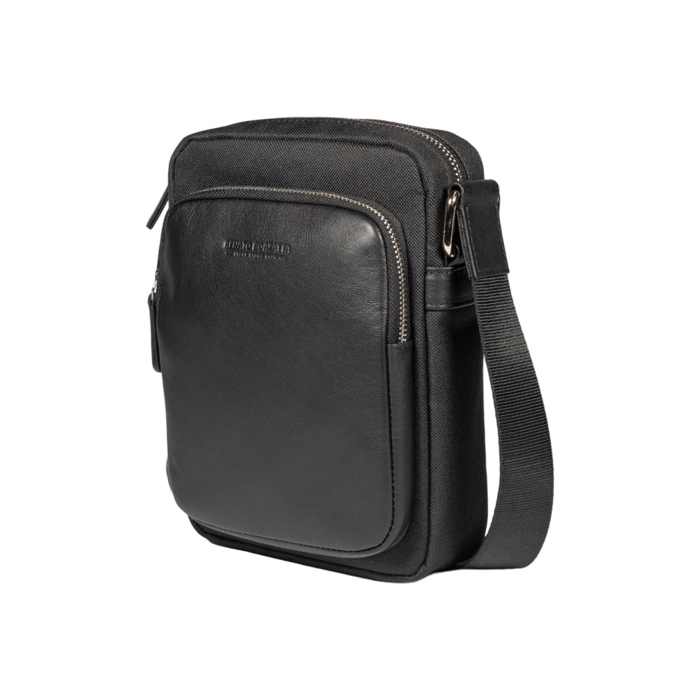 RB2002A | Nylon/Vera Leather Shoulder Bag, with light grain. Zipper closure and adjustable shoulder strap - Black color - Size: 15.5 x 21 x 7 cm. Packaging: Non-Woven Fabric Bag-0